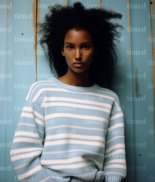 tinted-black-woman-in-blue-and-white-sweater-6df60a699121