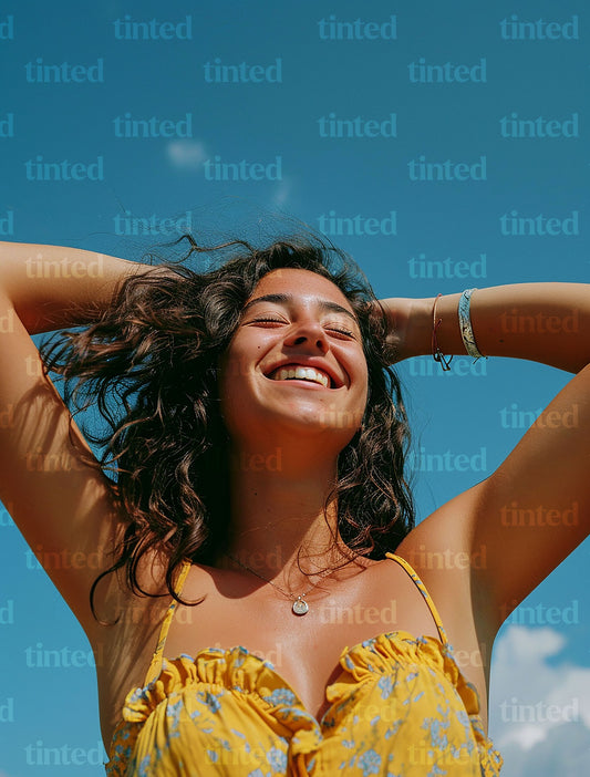 tinted-woman-smiling-with-hand-with-hands-in-her-hair-039d5c557718
