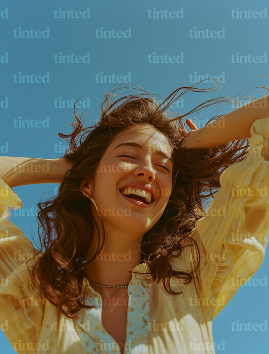 tinted-woman-smiling-with-hand-with-hands-in-her-hair-b8c4b1ea17ec